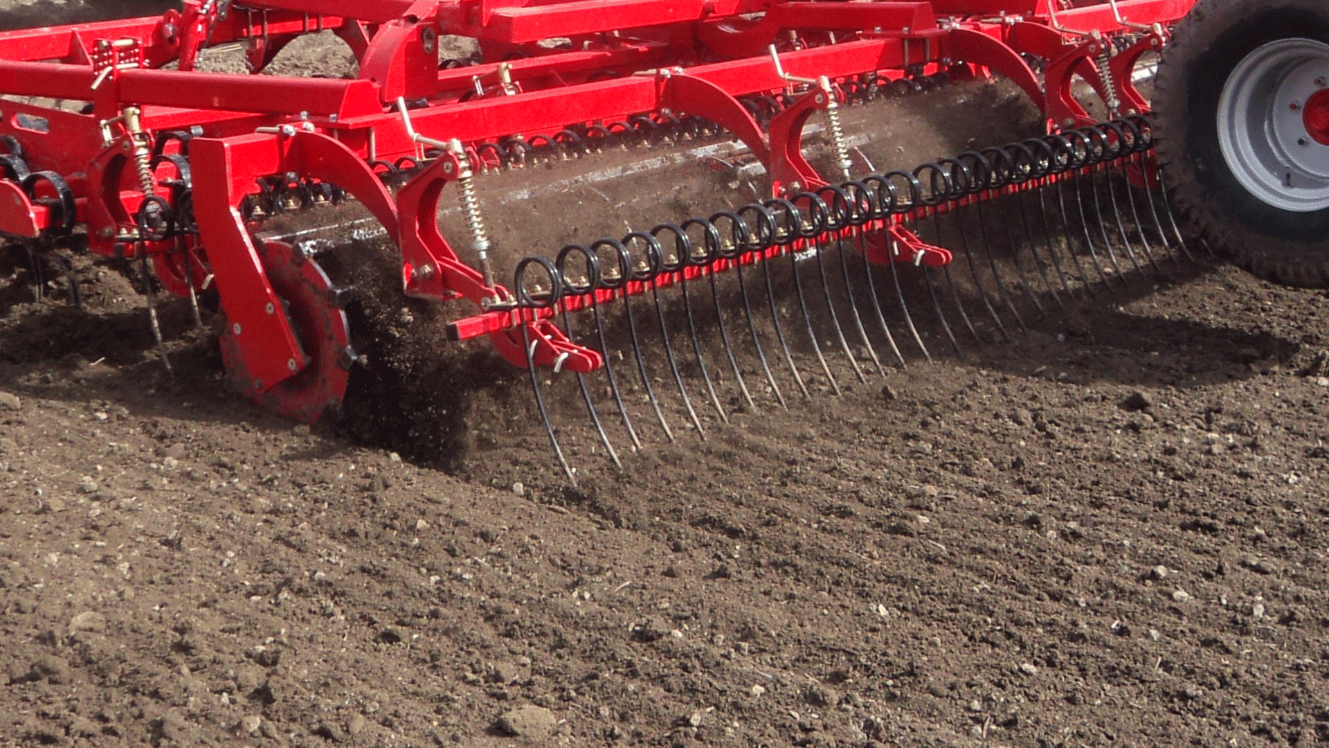 Long finger after-harrow behind roller